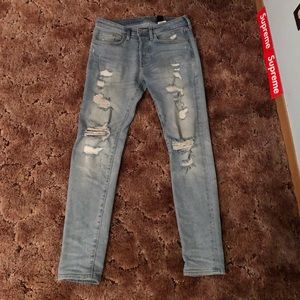 Light blue jeans with rips